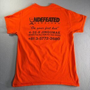 Undefeated Japan Harajuku Exclusive "on your feet kid" Orange Shirt Size Med